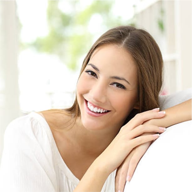 A woman with a bright, white smile showcasing the results of teeth whitening in North Canton, Ohio.